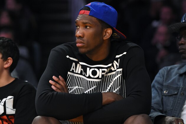 Kansas center Joel Embiid watches the Los Angeles Lakers play the Memphis Grizzlies in an NBA basketball game, Sunday, April 13, 2014, in Los Angeles. The Grizzlies won 102-90. (AP Photo/Mark J. Terrill) Kansas center Joel Embiid watches the Los Angeles Lakers play the Memphis Grizzlies in an NBA basketball game, Sunday, April 13, 2014, in Los Angeles. The Grizzlies won 102-90. (AP Photo/Mark J. Terrill)