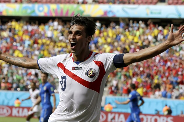 Costa Rica's Bryan Ruiz celebrates after scoring his side's first goal over Italy's goalkeeper Gianluigi Buffon during the group D World Cup soccer match between Italy and Costa Rica at the Arena Pernambuco in Recife, Brazil, Friday, June 20, 2014.  (AP Photo/Ricardo Mazalan)