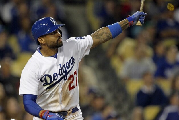 Los Angeles Dodgers’ Matt Kemp hits a double to score Hanley Ramirez in the sixth inning of a baseball game on Monday, June 16, 2014, in Los Angeles.   (AP Photo/Alex Gallardo)