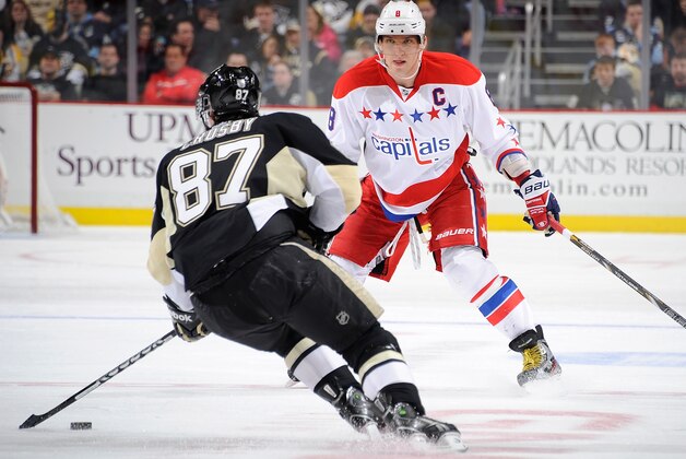 PITTSBURGH, PA - MARCH 19:  Sidney Crosby #87 of the Pittsburgh Penguins tries to get past the defense of Alex Ovechkin #8 of the Washington Capitals on March 19, 2013 at Consol Energy Center in Pittsburgh, Pennsylvania.  (Photo by Joe Sargent/NHLI via Getty Images)