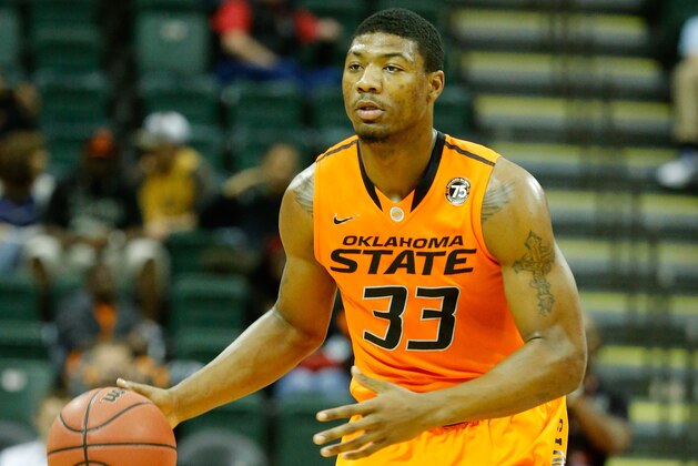 ORLANDO, FL - DECEMBER 01:  Marcus Smart #33 of the Oklahoma State Cowboys in action during the Old Spice Classic against the Memphis Tigers at HP Field House on December 1, 2013 in Orlando, Florida.  (Photo by Sam Greenwood/Getty Images)