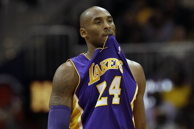 Los Angeles Lakers guard Kobe Bryant (24) chews on his jersey in the second half of an NBA  basketball game against the Atlanta Hawks, Monday, Dec. 16, 2013, in Atlanta. The Hawks held Bryant to 8 points and won 114-100. (AP Photo/John Bazemore)