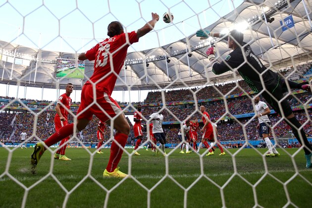 SALVADOR, BRAZIL - JUNE 20: Olivier Giroud of France scores his team's first goal on a header past goalkeeper Diego Benaglio of Switzerland during the 2014 FIFA World Cup Brazil Group E match between Switzerland and France at Arena Fonte Nova on June 20, 2014 in Salvador, Brazil.  (Photo by Warren Little/Getty Images)