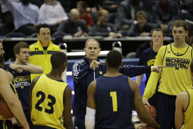 Michigan head coach John Beilein directs his team during a practice session for their NCAA college basketball tournament game Wednesday, March 19, 2014, in Milwaukee. Michigan plays Wofford on Thursday. (AP Photo/Morry Gash)