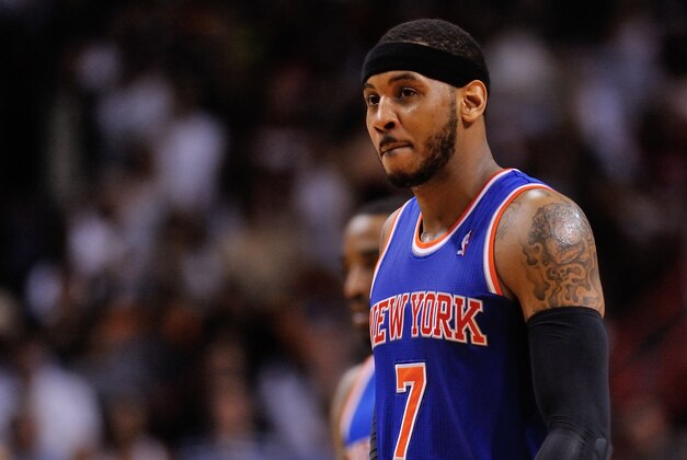 Apr 6, 2014; Miami, FL, USA; New York Knicks forward Carmelo Anthony (7) walks back to the bench during the second half against the Miami Heat at American Airlines Arena. Miami won 102-91. Mandatory Credit: Steve Mitchell-USA TODAY Sports Apr 6, 2014; Miami, FL, USA; New York Knicks forward Carmelo Anthony (7) walks back to the bench during the second half against the Miami Heat at American Airlines Arena. Miami won 102-91. Mandatory Credit: Steve Mitchell-USA TODAY Sports