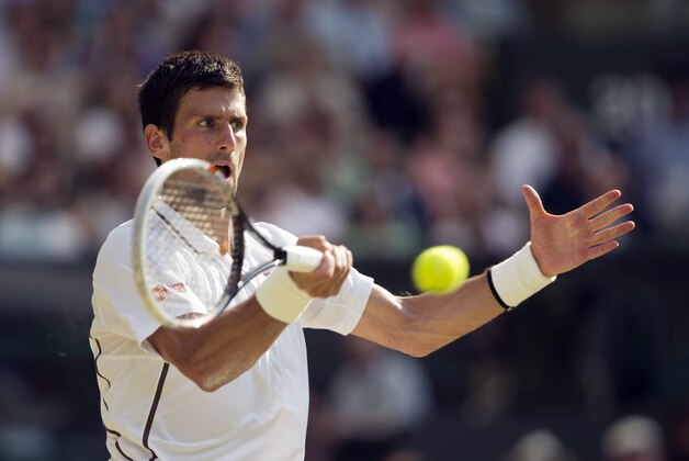 Jul 7, 2013; London, United Kingdom; Novak Djokovic (SRB) during his match against Andy Murray (GBR) on day 13 of the 2013 Wimbledon Championships at the All England Lawn Tennis Club. Mandatory Credit: Susan Mullane-USA TODAY Sports
