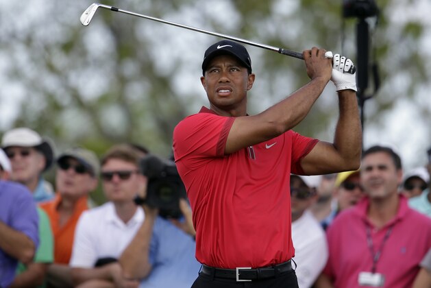 Tiger Woods tees off on the fourth hole during the final round of the Cadillac Championship golf tournament Sunday, March 9, 2014, in Doral, Fla. (AP Photo/Lynne Sladky)