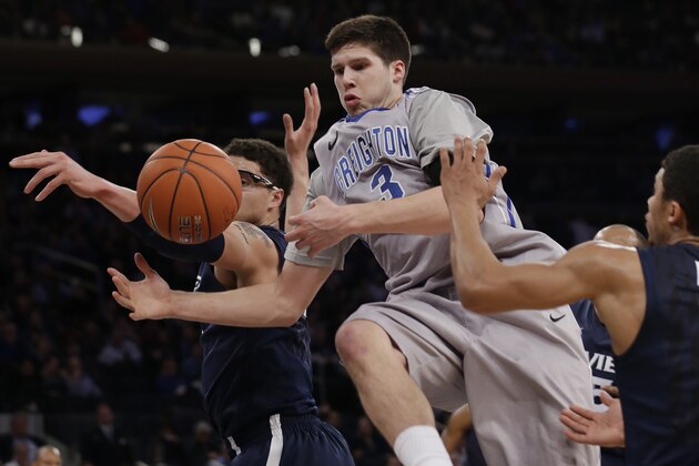 Creighton's Doug McDermott (3) fights for control of the ball during the first half of an NCAA college basketball game against Xavier in the semifinals of the Big East Conference tournament Friday, March 14, 2014, at Madison Square Garden in New York. (AP Photo/Frank Franklin II)