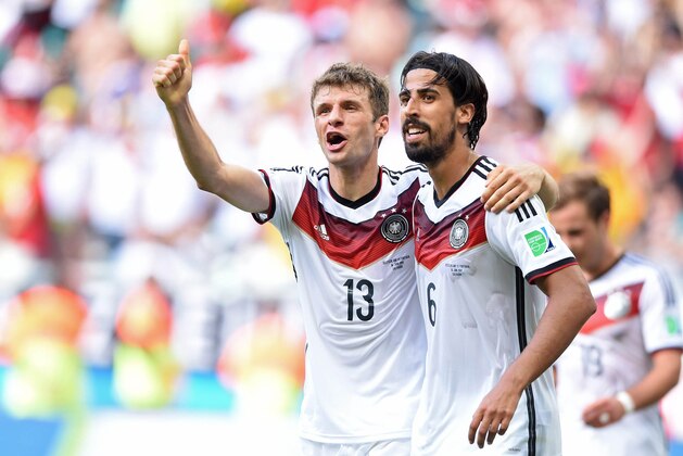 June 16, 2014; Salvador, BRAZIL; Germany players Thomas Mueller (13) and Sami Khedira celebrate a goal against Portugal during Group G play during the 2014 World Cup at Arena Fonte Nova.  Mandatory Credit: Tim Groothuis/Witters Sport via USA TODAY Sports