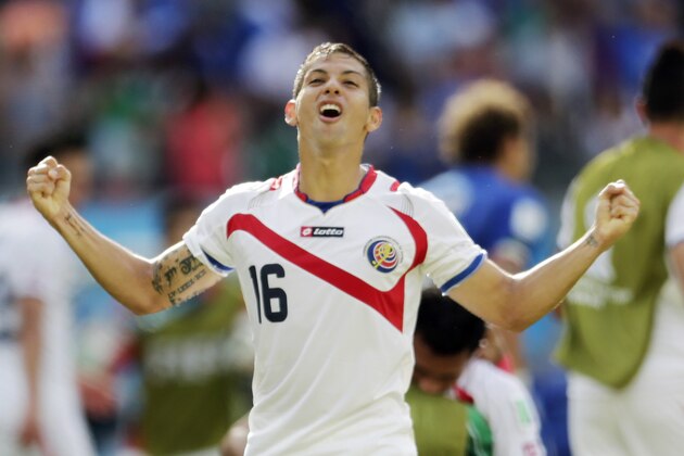 Costa Rica's Cristian Gamboa celebrates after the team's 1-0 victory over Italy during the group D World Cup soccer match between Italy and Costa Rica at the Arena Pernambuco in Recife, Brazil, Friday, June 20, 2014. (AP Photo/Petr David Josek)