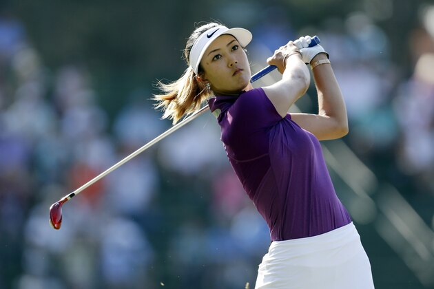 Michelle Wie watches her tee shot on the 13th hole during the second round of the U.S. Women's Open golf tournament in Pinehurst, N.C., Friday, June 20, 2014. (AP Photo/Bob Leverone) Michelle Wie watches her tee shot on the 13th hole during the second round of the U.S. Women's Open golf tournament in Pinehurst, N.C., Friday, June 20, 2014. (AP Photo/Bob Leverone)