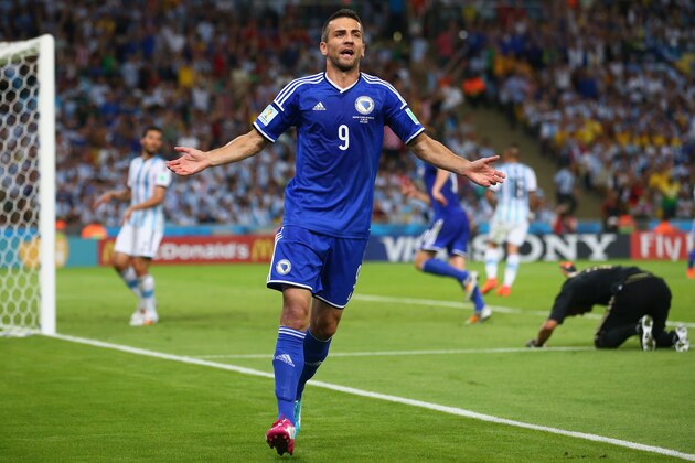 RIO DE JANEIRO, BRAZIL - JUNE 15:  Vedad Ibisevic of Bosnia and Herzegovina celebrates scoring his team's first goal during the 2014 FIFA World Cup Brazil Group F match between Argentina and Bosnia-Herzegovina at Maracana on June 15, 2014 in Rio de Janeiro, Brazil.  (Photo by Julian Finney/Getty Images)
