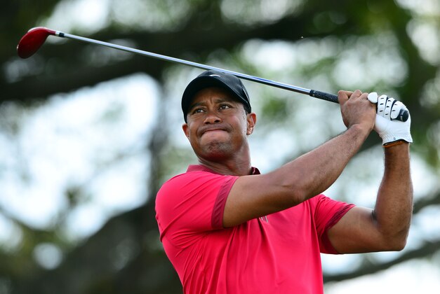 Mar 9, 2014; Miami, FL, USA; Tiger Woods tees off from the 5th hole during the final round of the WGC - Cadillac Championship golf tournament at TPC Blue Monster at Trump National Doral. Mandatory Credit: Andrew Weber-USA TODAY Sports