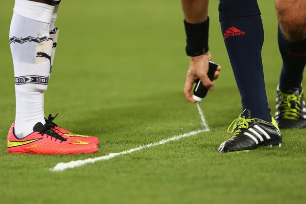 NATAL, BRAZIL - JUNE 16: Referee Jonas Eriksson of Sweden sprays foam to mark the free kick distance during the 2014 FIFA World Cup Brazil Group G match between Ghana and the United States at Estadio das Dunas on June 16, 2014 in Natal, Brazil.  (Photo by Michael Steele/Getty Images)
