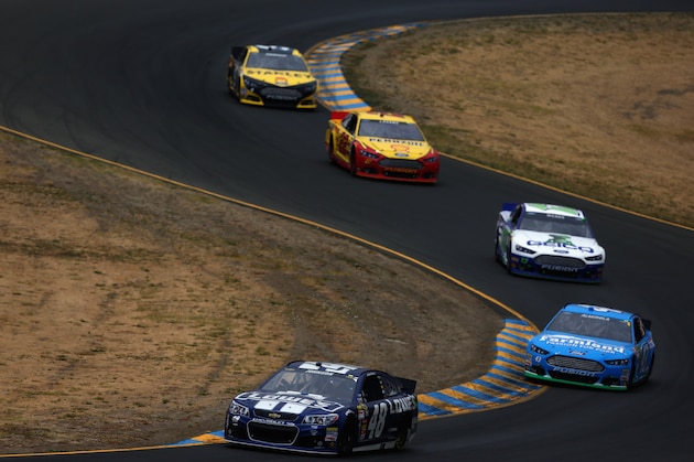 SONOMA, CA - JUNE 23:  Jimmie Johnson, driver of the #48 Lowe's Chevrolet, leads Aric Almirola, driver of the #43 Farmland Ford, during the NASCAR Sprint Cup Series Toyota/Save Mart 350 at Sonoma Raceway on June 23, 2013 in Sonoma, California.  (Photo by Tom Pennington/Getty Images)