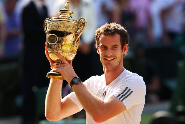 LONDON, ENGLAND - JULY 07:  Andy Murray of Great Britain poses with the Gentlemen's Singles Trophy following his victory in the Gentlemen's Singles Final match against Novak Djokovic of Serbia on day thirteen of the Wimbledon Lawn Tennis Championships at the All England Lawn Tennis and Croquet Club on July 7, 2013 in London, England.  (Photo by Julian Finney/Getty Images)