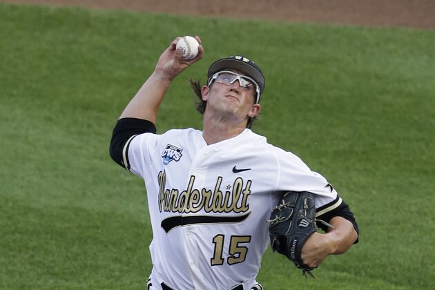 Vanderbilt pitcher Carson Fulmer (15) works against Louisville in the first inning of an NCAA baseball College World Series game in Omaha, Neb., Saturday, June 14, 2014. (AP Photo/Nati Harnik)