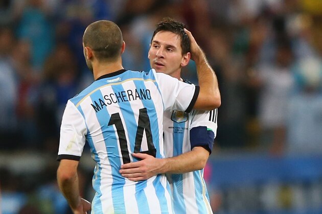 RIO DE JANEIRO, BRAZIL - JUNE 15:  Lionel Messi of Argentina and Javier Mascherano celebrate victory after the 2014 FIFA World Cup Brazil Group F match between Argentina and Bosnia-Herzegovina at Maracana on June 15, 2014 in Rio de Janeiro, Brazil.  (Photo by Jamie Squire/Getty Images)