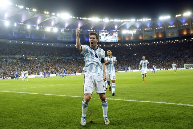 In this Sunday, June 15, 2014 photo, Argentina's Lionel Messi celebrates scoring his side's second goal during the group F World Cup soccer match between Argentina and Bosnia at the Maracana Stadium in Rio de Janeiro, Brazil. After a frustrating first half, the Argentina captain scored in trademark style in the 65th minute on Sunday night, completing a quick 1-2 connection with Gonzalo Higuain and running through defenders before striking a brilliant left-footed shot off the post. (AP Photo/Victor R. Caivano)