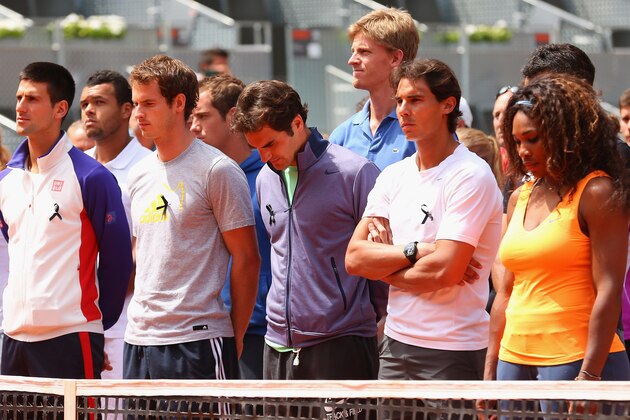 MADRID, SPAIN - MAY 05:  Tennis players including Novak Djokovic, Andy Murray, Roger Federer, Rafael Nadal and Serena Williams arrive on court to observe a moment of silence for Brad Drewett during day two of the Mutua Madrid Open tennis tournament at the Caja Magica on May 5, 2013 in Madrid, Spain. He was a former tour player who led the ATP as executive chairman and president since January 2012, died Friday after a battle with motor neurone disease. He was 54.  (Photo by Julian Finney/Getty Images)