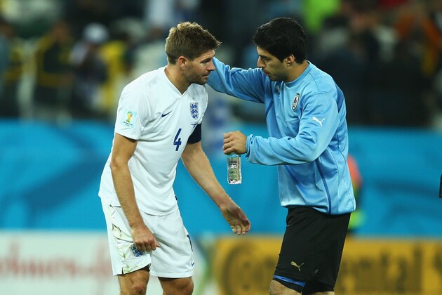 SAO PAULO, BRAZIL - JUNE 19:  Luis Suarez of Uruguay consoles Steven Gerrard of England after Uruguay's 2-1 victory in the 2014 FIFA World Cup Brazil Group D match between Uruguay and England at Arena de Sao Paulo on June 19, 2014 in Sao Paulo, Brazil.  (Photo by Clive Rose/Getty Images)