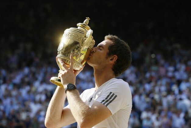 Andy Murray of Britain poses with the trophy after defeating Novak Djokovic of Serbia during the Men's singles final match at the All England Lawn Tennis Championships in Wimbledon, London, Sunday, July 7, 2013. (AP Photo/Kirsty Wigglesworth)