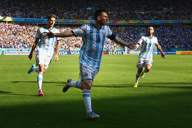 BELO HORIZONTE, BRAZIL - JUNE 21:  Lionel Messi of Argentina celebrates scoring his team's first goal during the 2014 FIFA World Cup Brazil Group F match between Argentina and Iran at Estadio Mineirao on June 21, 2014 in Belo Horizonte, Brazil.  (Photo by Ronald Martinez/Getty Images)