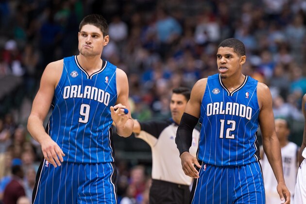Oct 14, 2013; Dallas, TX, USA; Orlando Magic center Nikola Vucevic (9) and small forward Tobias Harris (12) and Dallas Mavericks small forward Jae Crowder (9) wait for play to resume during the game at the American Airlines Center. The Magic defeated the Mavericks 102-94. Mandatory Credit: Jerome Miron-USA TODAY Sports
