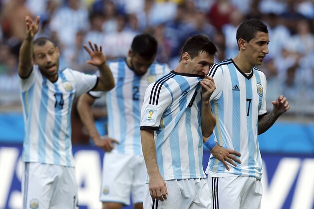 Argentina's Angel di Maria, right, and Lionel Messi stand together during the group F World Cup soccer match between Argentina and Iran at the Mineirao Stadium in Belo Horizonte, Brazil, Saturday, June 21, 2014.   (AP Photo/Victor R. Caivano)