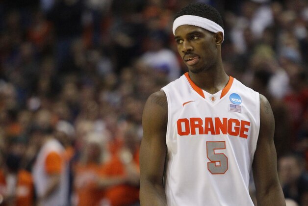 Syracuse forward C.J. Fair (5) reacts late in the second half of a third-round game against Dayton in the NCAA men's college basketball tournament in Buffalo, N.Y., Saturday, March 22, 2014. Dayton won the game 55-53. (AP Photo/Bill Wippert)