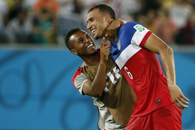 Jun 16, 2014; Natal, Rio Grande do Norte, BRAZIL; United States defender John Brooks (6) is hugged by midfielder Julian Green (16) after his goal beat Ghana 2-1 during their 2014 World Cup game at Estadio das Dunas. Mandatory Credit: Winslow Townson-USA TODAY Sports