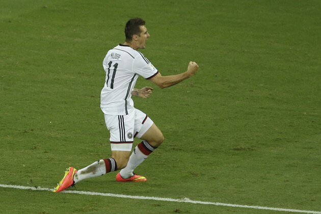 Germany's Miroslav Klose shouts out as he celebrates scoring his side's second goal during the group G World Cup soccer match between Germany and Ghana at the Arena Castelao in Fortaleza, Brazil, Saturday, June 21, 2014. (AP Photo/Themba Hadebe)