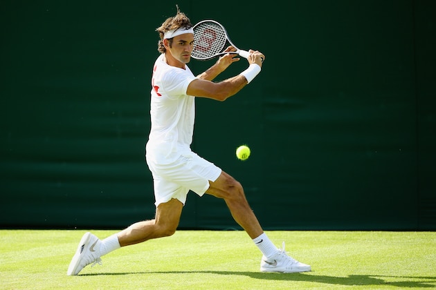 LONDON, ENGLAND - JUNE 21:  Roger Federer of Switzerland in action during a practice session during previews for Wimbledon Championships at Wimbledon on June 21, 2014 in London, England.  (Photo by Al Bello/Getty Images)