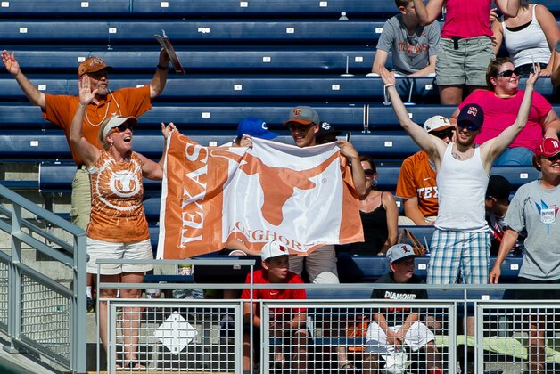 Jun 20, 2014; Omaha, NE, USA; Texas Longhorns bleacher fans celebrate during game eleven of the 2014 College World Series against the Vanderbilt Commodores at TD Ameritrade Park Omaha. Texas defeated Vanderbilt 4-0. Mandatory Credit: Steven Branscombe-USA TODAY Sports