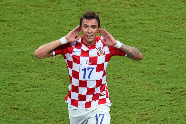MANAUS, BRAZIL - JUNE 18:  Mario Mandzukic of Croatia celebrates scoring the third goal during the 2014 FIFA World Cup Brazil Group A match between Cameroon and Croatia at Arena Amazonia on June 18, 2014 in Manaus, Brazil.  (Photo by Stu Forster/Getty Images)