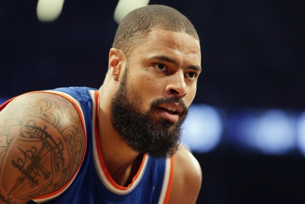 NEW YORK, NY - APRIL 15: Tyson Chandler #6 of the New York Knicks waits for play to begin against the Brooklyn Nets at the Barclays Center on April 15, 2014 in the Brooklyn borough of New York City. NOTE TO USER: User expressly acknowledges and agrees that, by downloading and/or using this Photograph, user is consenting to the terms and conditions of the Getty Images License Agreement.  (Photo by Bruce Bennett/Getty Images)