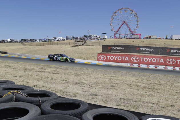 Carl Edwards races during qualifying for the NASCAR Sprint Cup Series auto race Saturday, June 21, 2014, in Sonoma, Calif. Jamie McMurray was the pole winner. (AP Photo/Eric Risberg)