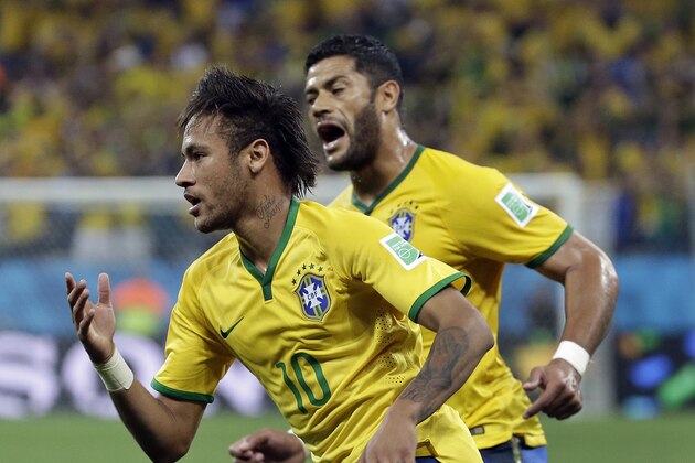 Brazil's Neymar celebrates with  Hulk after Neymar scored his sides first goal during the group A World Cup soccer match between Brazil and Croatia, the opening game of the tournament, in the Itaquerao Stadium in Sao Paulo, Brazil, Thursday, June 12, 2014.   (AP Photo/Felipe Dana)