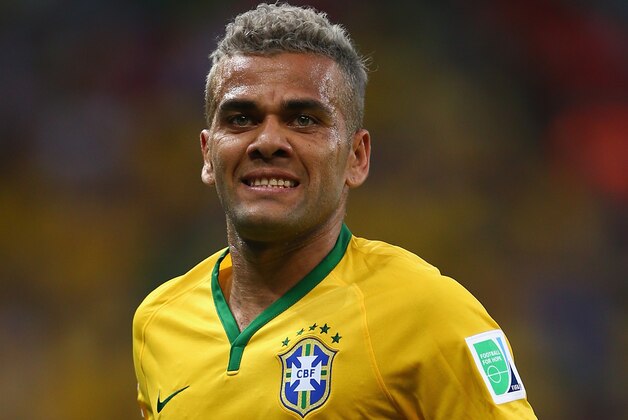 FORTALEZA, BRAZIL - JUNE 17:  Dani Alves of Brazil looks on during the 2014 FIFA World Cup Brazil Group A match between Brazil and Mexico at Castelao on June 17, 2014 in Fortaleza, Brazil.  (Photo by Michael Steele/Getty Images)