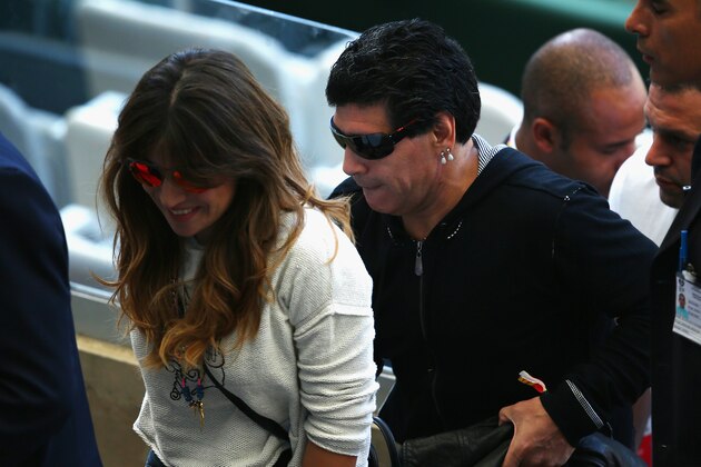 BELO HORIZONTE, BRAZIL - JUNE 21:  Diego Maradona (R) and his daughter Giannina Maradona look on during the 2014 FIFA World Cup Brazil Group F match between Argentina and Iran at Estadio Mineirao on June 21, 2014 in Belo Horizonte, Brazil.  (Photo by Ian Walton/Getty Images)