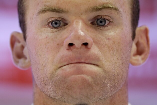 England national soccer team player Wayne Rooney attends a press conference after a squad training session for the 2014 soccer World Cup at the Urca military base in Rio de Janeiro, Brazil, Saturday, June 21, 2014.  Costa Rica's surprise 1-0 win over Italy on Friday meant that England made its most humiliating exit from a World Cup since 1958, following consecutive defeats by the Italians and then Uruguay in Group D.  England play Costa Rica in their final Group D match on Tuesday.  (AP Photo/Matt Dunham)