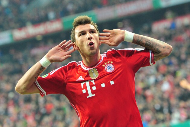 Munich's Mario Mandzukic of Croatia celebrates after scoring during the German soccer cup, DFB Pokal, semifinal soccer match between FC Bayern Munich and FC Kaiserslautern in the Allianz Arena in Munich, Germany, on Wednesday, April 16. 2014. (AP Photo/Kerstin Joensson)