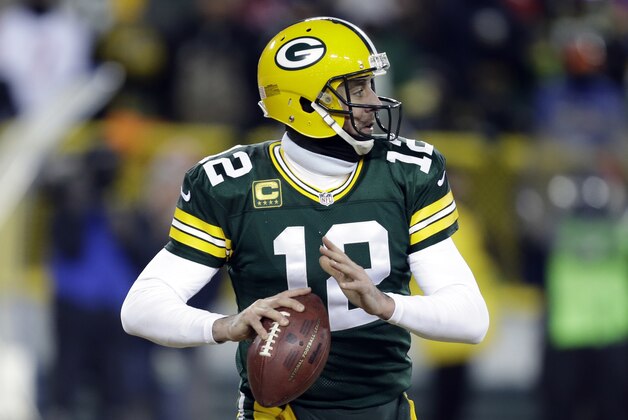 Green Bay Packers quarterback Aaron Rodgers (12) looks for a receiver during the second half of an NFL wild-card playoff football game against the San Francisco 49ers, Sunday, Jan. 5, 2014, in Green Bay, Wis. (AP Photo/Mike Roemer)