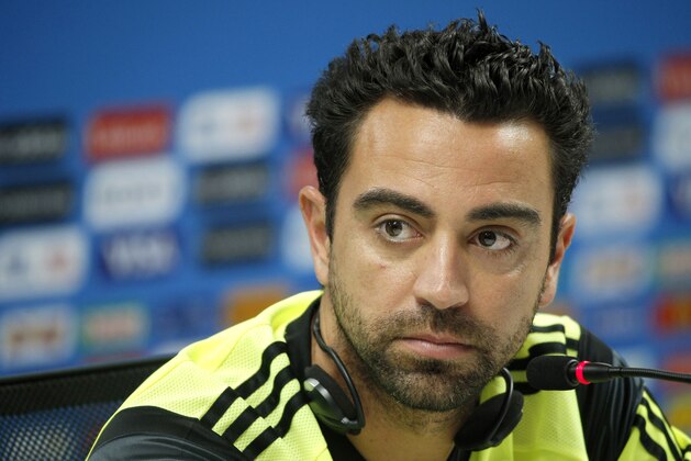 Spain's Xavi Hernandez attends a press conference the day before the group B World Cup soccer match between Spain and the Netherlands at the Arena Ponte Nova in Salvador, Brazil, Thursday, June 12, 2014.  (AP Photo/Christophe Ena)