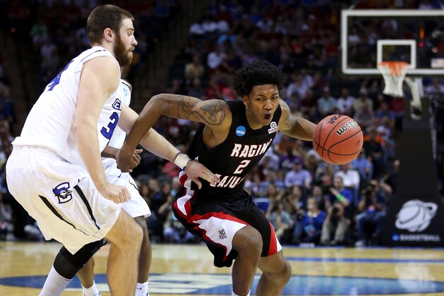 SAN ANTONIO, TX - MARCH 21: Elfrid Payton #2 of the Louisiana Lafayette Ragin Cajuns handles the ball against Ethan Wragge #34 of the Creighton Bluejays in the second half during the second round of the 2014 NCAA Men's Basketball Tournament at AT&T Center on March 21, 2014 in San Antonio, Texas.  (Photo by Ronald Martinez/Getty Images)
