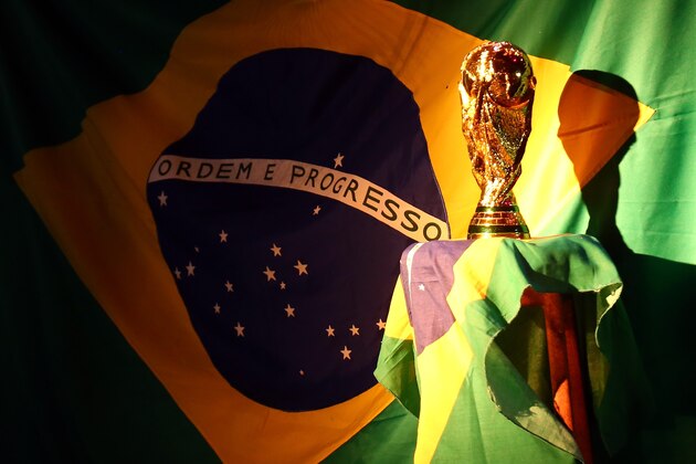 PORTO SEGURO, BRAZIL - JUNE 12:  A replica of the FIFA world cup trophy is displayed during the Group A match between Brazil and Croatia on June 12, 2014 in Porto Seguro, Brazil.  (Photo by Martin Rose/Getty Images)