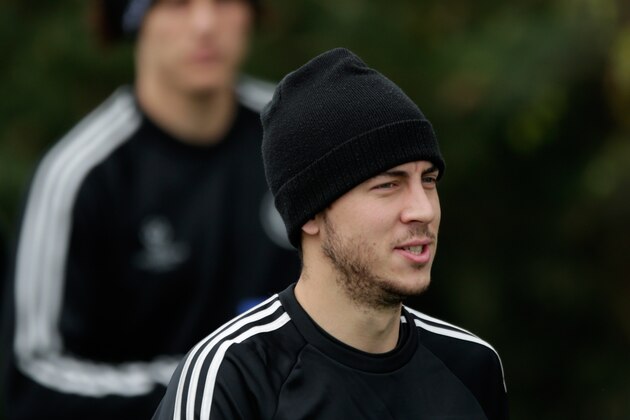 Chelsea's Eden Hazard arrives for a training session at their facilities in Stoke d'Abernon, near London, Monday, April 7, 2014.  Paris Saint-Germain take a 3-1 lead from the first leg into their second leg Champions League quarterfinal soccer match against Chelsea on Tuesday.  (AP Photo/Matt Dunham).
