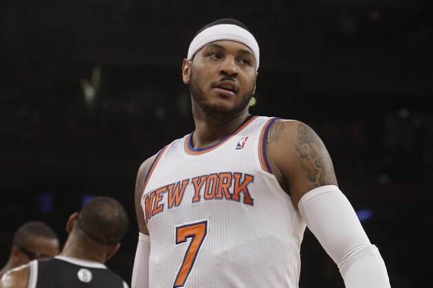 New York Knicks' Carmelo Anthony (7) reacts after scoring during the first half of an NBA basketball game against the Brooklyn Nets Wednesday, April 2, 2014, in New York.  (AP Photo/Frank Franklin II)