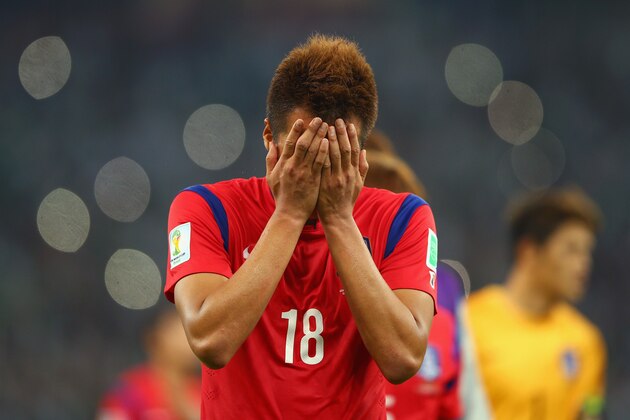 PORTO ALEGRE, BRAZIL - JUNE 22:  A dejected Kim Shin-Wook of South Korea reacts after being defeated by Algeria 4-2 during the 2014 FIFA World Cup Brazil Group H match between South Korea and Algeria at Estadio Beira-Rio on June 22, 2014 in Porto Alegre, Brazil.  (Photo by Paul Gilham/Getty Images)