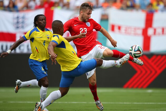 MIAMI GARDENS, FL - JUNE 04:  Luke Shaw of England and Jorge Guagua of Ecuador battle for the ball during the International friendly match between England and Ecuador at Sun Life Stadium on June 4, 2014 in Miami Gardens, Florida.  (Photo by Richard Heathcote/Getty Images)